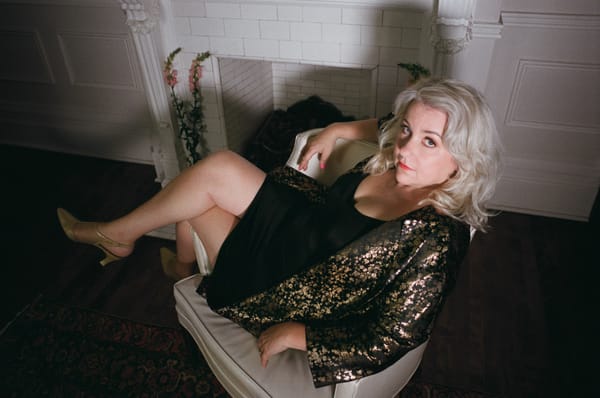 Amy Millan lounging on a chair